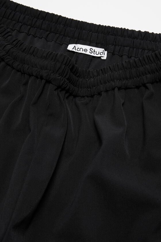Acne Studios Figurnahe Hose Kostenlose Rückgabe